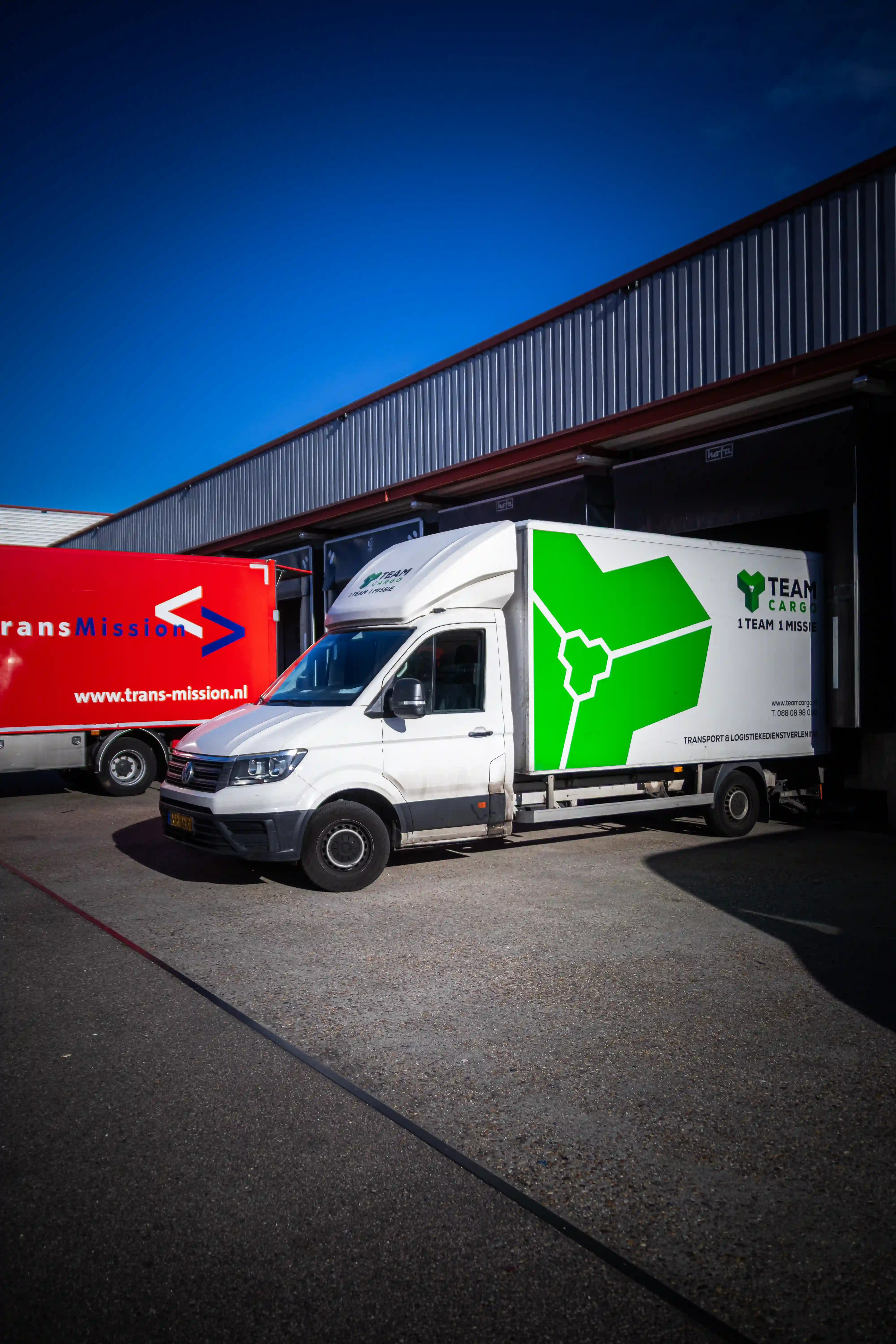 Logistics workers uploading parcels